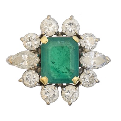 Lot 36 - An 18ct gold emerald and diamond cluster ring by Boodles & Dunthorne