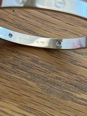 Lot 56 - An 18ct gold Cartier diamond 'love' bangle