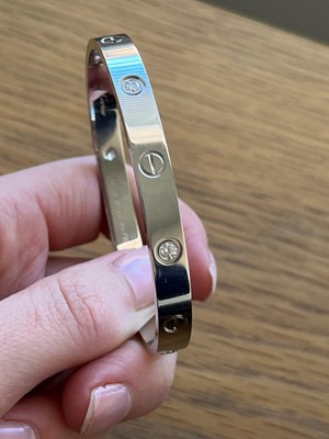 Lot 56 - An 18ct gold Cartier diamond 'love' bangle