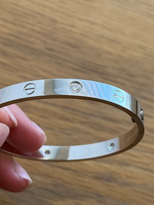Lot 56 - An 18ct gold Cartier diamond 'love' bangle