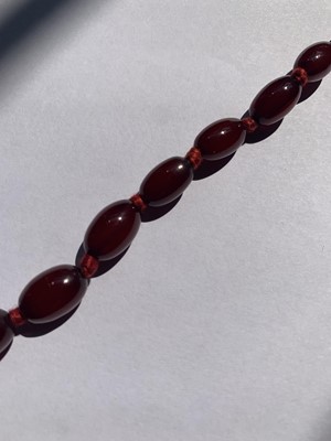 Lot 83 - A cherry bakelite necklace