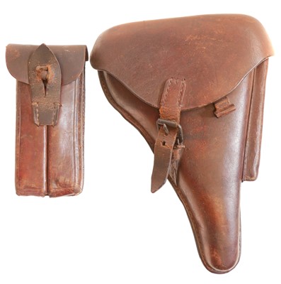 Lot 535 - Luger holster, stripping tool, magazine and two division magazine pouch.