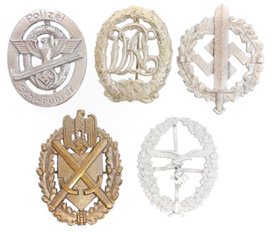 Lot 320 - Five German Third Reich uniform badges.