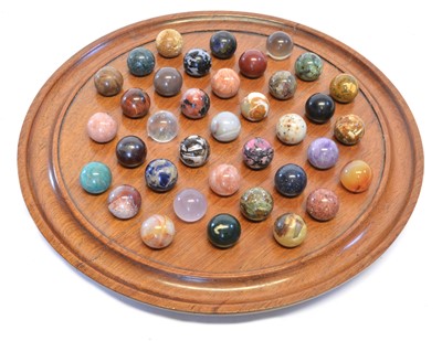 Lot 194 - Specimen Stone Marbles on a Solitaire Board