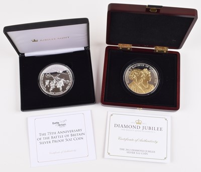 Lot 34 - Two cased 5oz silver coins to include 75th anniversary of Battle of Britain and Diamond Jubilee (2).