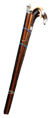 Lot 94 - A selection of silver topped walking sticks