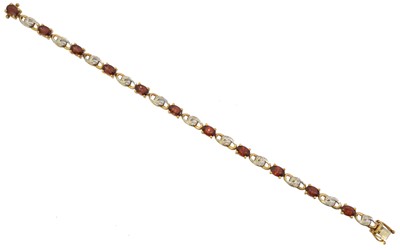 Lot 41 - A 9ct gold garnet and diamond bracelet