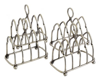 Lot 137 - Four silver miniature toast racks