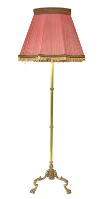 Lot 263 - Brass standard lamp and shade