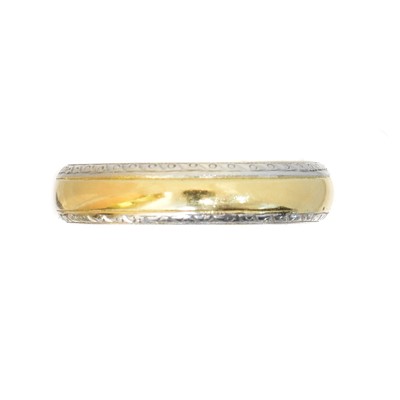 Lot 57 - An 18ct gold and platinum band ring