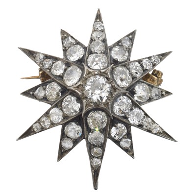 Lot 1 - A diamond star brooch.