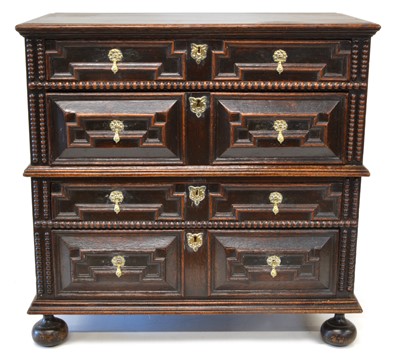 Lot 269 - A late 17th century oak geometric moulded chest of drawers.