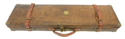 Lot 321 - Leather gun case, with brass corners and...
