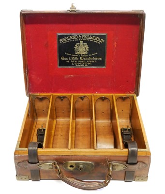 Lot 324 - Leather and oak cartridge magazine, with brass...