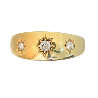 Lot 103 - An 18ct gold diamond three stone ring
