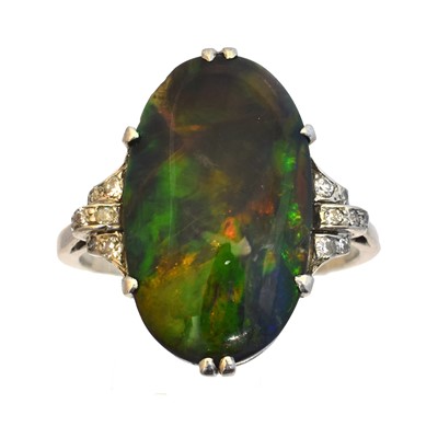 Lot 113 - An early 20th century black opal and diamond dress ring
