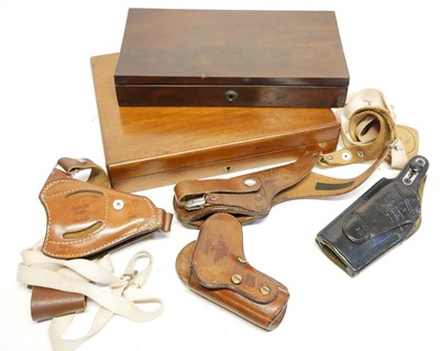 Lot 466 - Four holsters and two pistol cases, including...