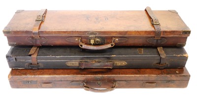 Lot 455 - Three leather shotgun cases, one labelled...