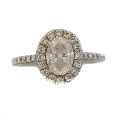 Lot 143 - A platinum diamond halo cluster ring.