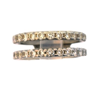 Lot 144 - A platinum diamond band ring.