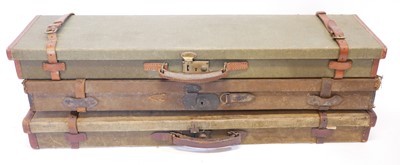 Lot 463 - Three canvas and leather shotgun cases, each...