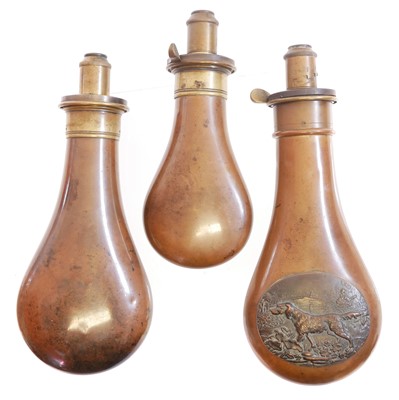 Lot 467 - Three copper and brass powder flasks by M....