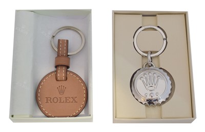 Lot 240 - Two Rolex keyrings.