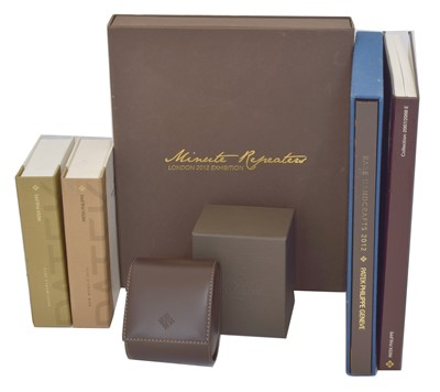 Lot 243 - Watch Parts & Accessories - Patek Philippe catalogues and a watch travel box.