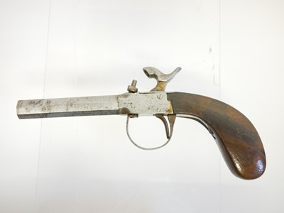 Lot 14 - Two percussion pistols, the first, an 18 bore...