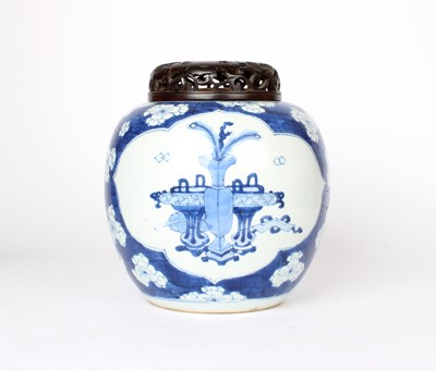 Lot 36 - A Chinese Kangxi Blue and White "Scholar's Objects" Ginger Jar with Hardwood Cover