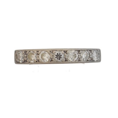 Lot 154 - A diamond band ring.