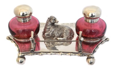 Lot 158 - An EPNS cranberry glass desk stand
