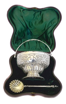 Lot 218 - A Victorian cased sugar bowl and sifter set
