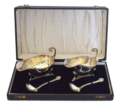 Lot 177 - A George IV silver cased sauce boat and ladle set