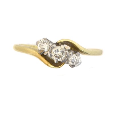 Lot 72 - A diamond three stone ring.