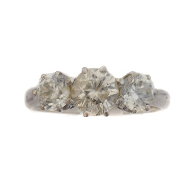 Lot 61 - A zircon three stone ring.