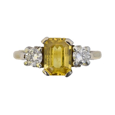 Lot 119 - An 18ct gold sapphire and diamond three stone ring.