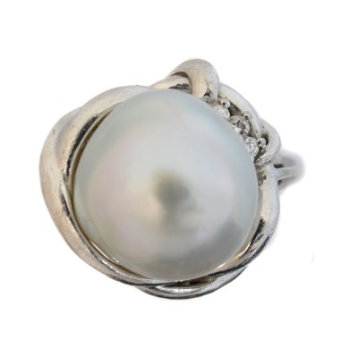 Lot 178 - A cultured pearl and diamond dress ring.