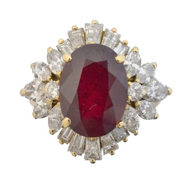 Lot 111 - A ruby and diamond cluster ring.