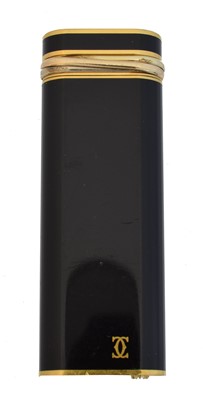 Lot 206 - A Must De Cartier gold plated Trinity lighter.