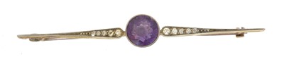 Lot 14 - An early 20th century amethyst and diamond bar brooch.