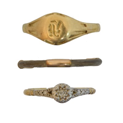 Lot 65 - Three dress rings.