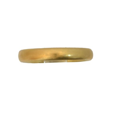 Lot 64 - A 22ct gold band ring.
