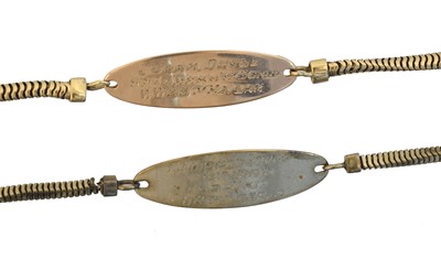 Lot 15 - Two Id bracelets.