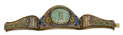 Lot 25 - A Chinese jade and enamel silver gilt hinged bangle.