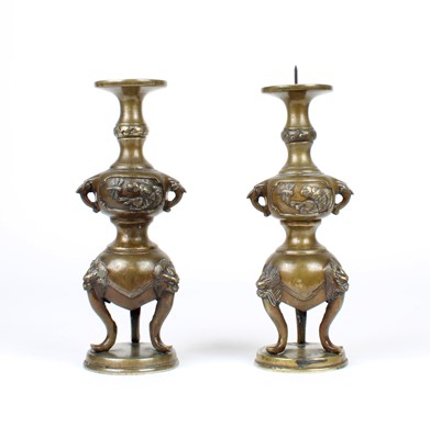 Lot 12 - A Pair of Chinese Bronze Twin-Handled Pricket Candlesticks