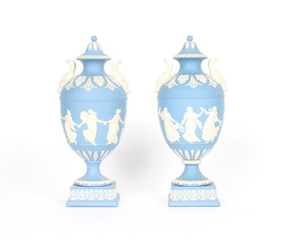 Lot 87 - A Near Pair of Wedgwood Blue Jasperware Twin-Handled Urns with Covers