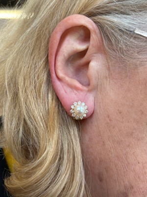 Lot 53 - A pair of cultured pearl and diamond earrings by Mikimoto.