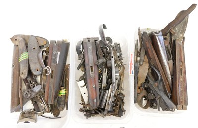 Lot 515 - Collection of gun parts, including top levers,...