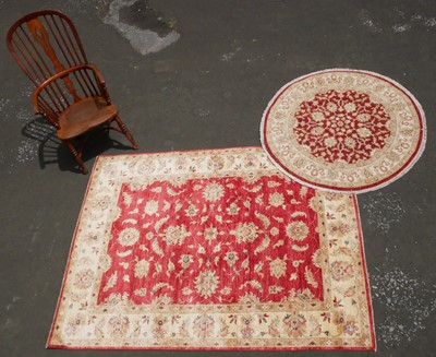 Lot 385 - A Modern Handmade Pakistan Garous Rug and Circular Mat